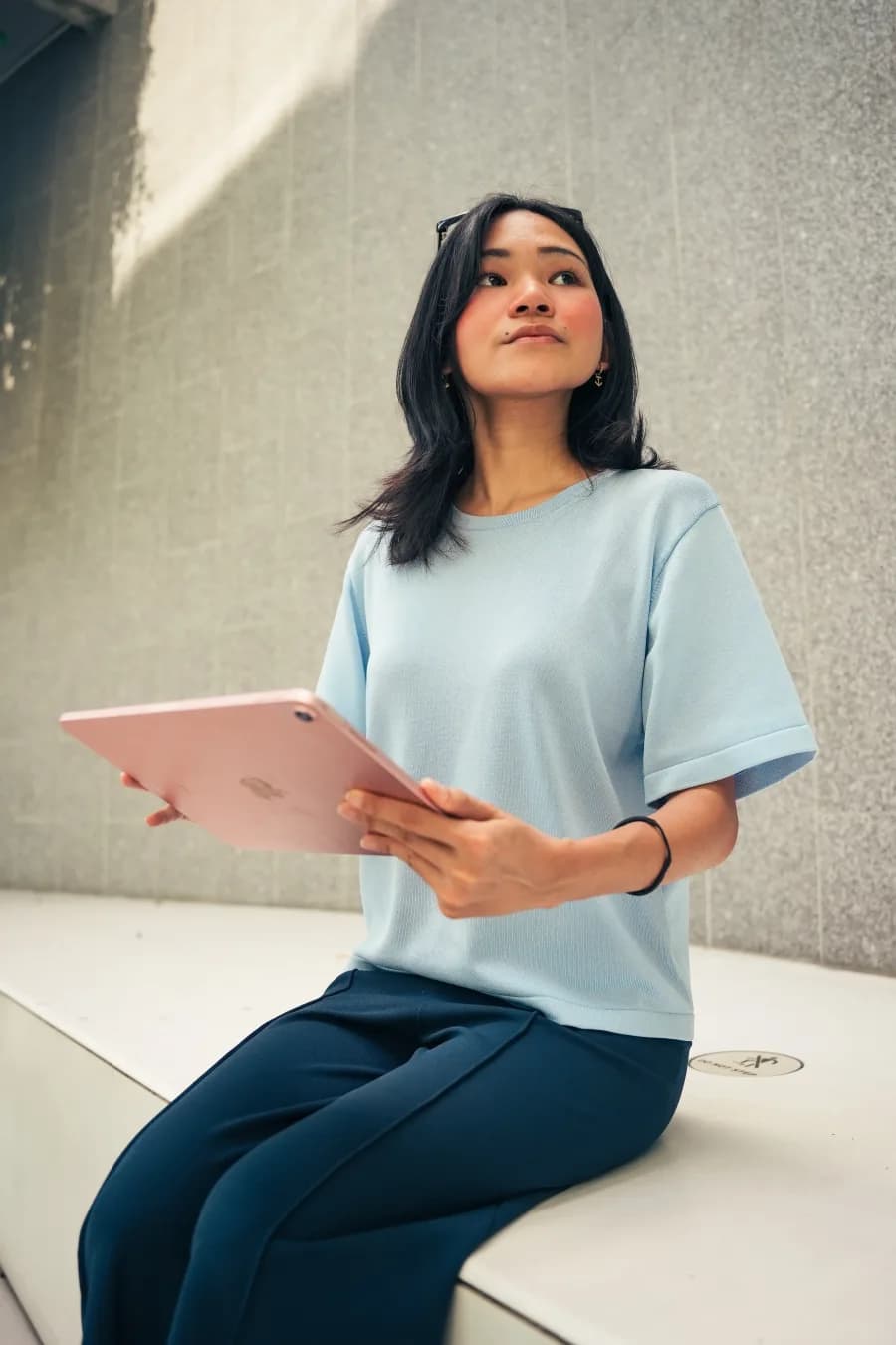 An Issa Compass teammate working on a tablet