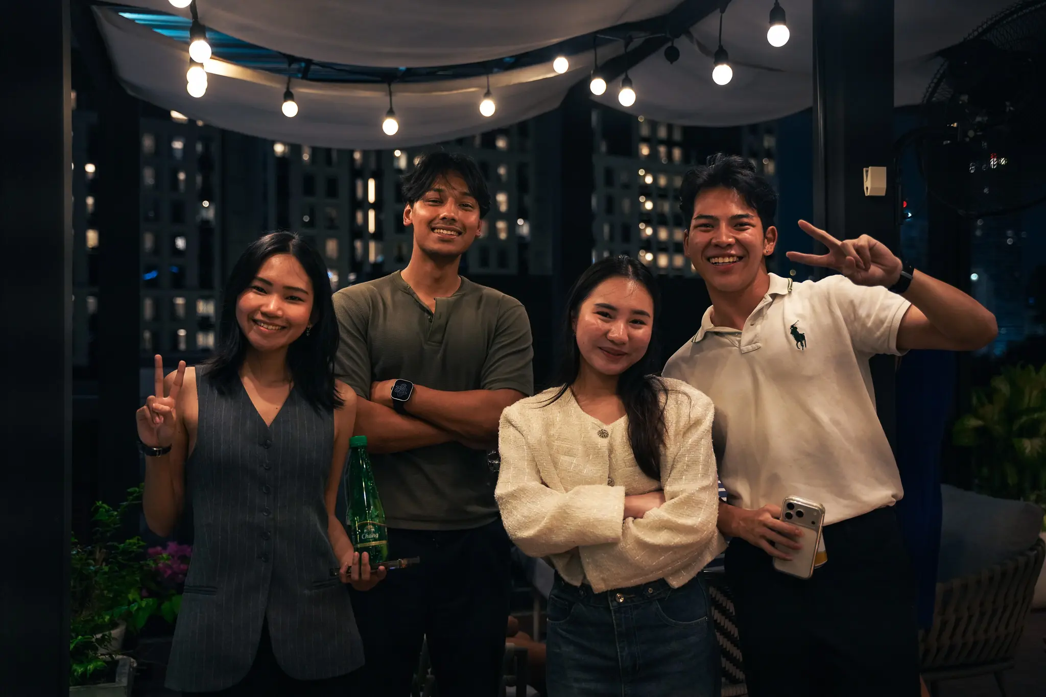 The Issa Compass team smiling together at night
