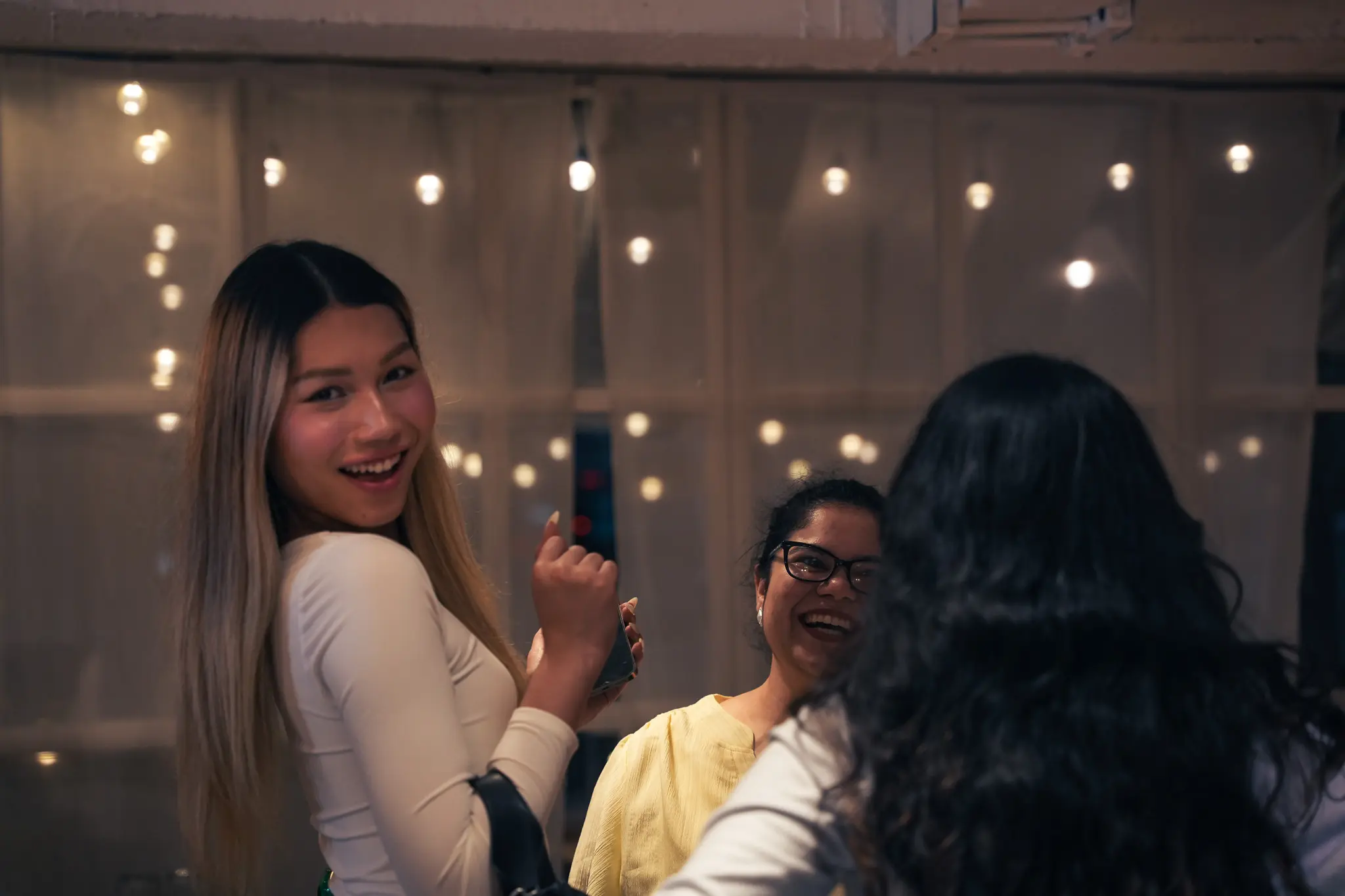 An Issa Compass teammate smiling back over her shoulder