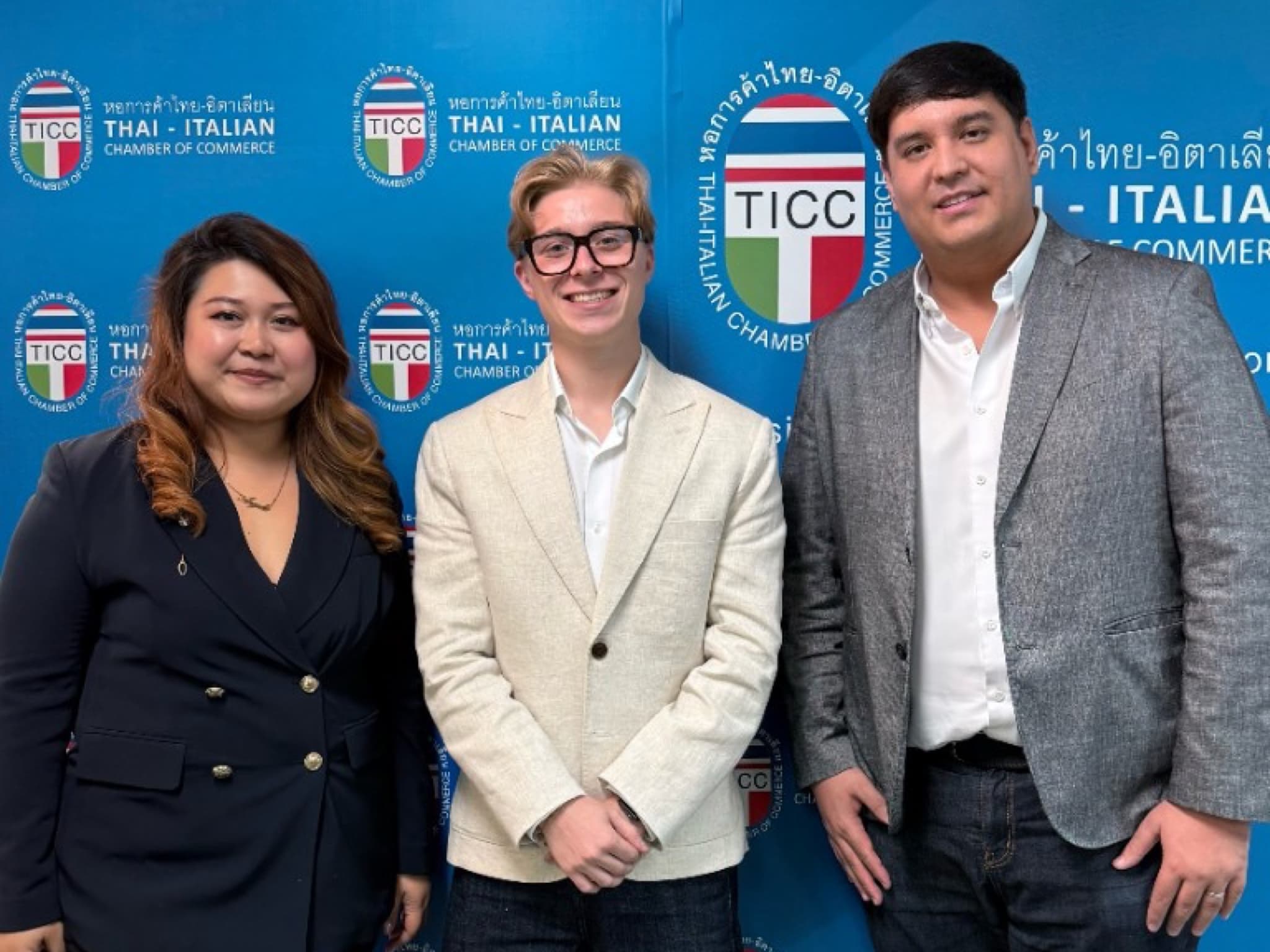 Issa Compass with Thai-Italian Chamber of Commerce members in front of the TICC backdrop in Bangkok