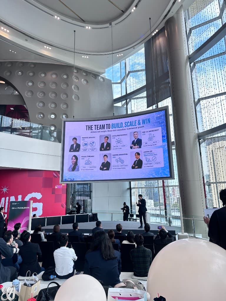 A founder pitching on the Chula Demo Day stage in front of the audience