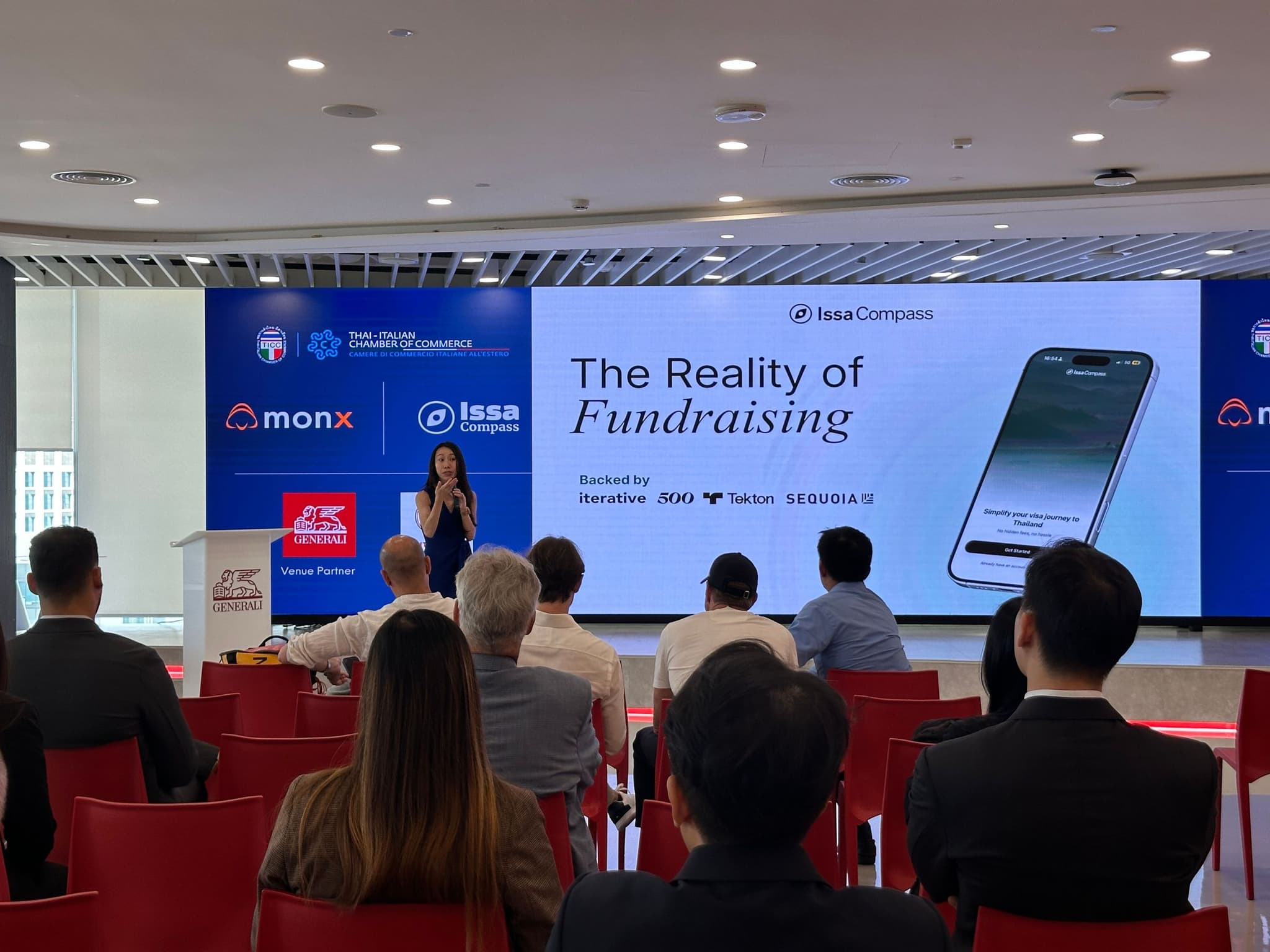 Priscilla Yeung presenting The Reality of Fundraising with the Issa Compass mobile app on screen at the TICC seminar